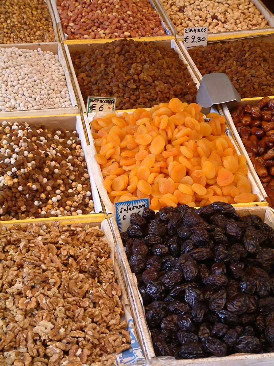 Assorted dry fruits including dates, apricots and nuts